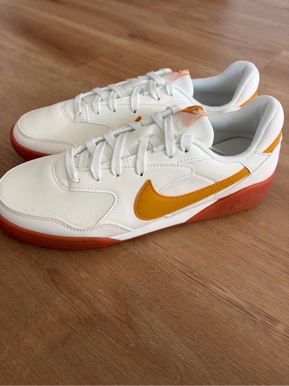 Nike Men’s White Sneakers with Orange Swoosh and Gum Sole